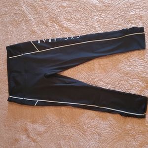 Free People Movement. Black Leggings w/ White Piping. CycleBar branded. Size L.
